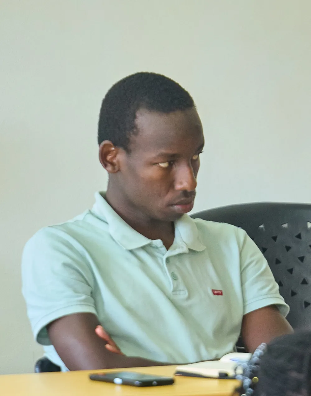 Fidel listening intently in a meeting